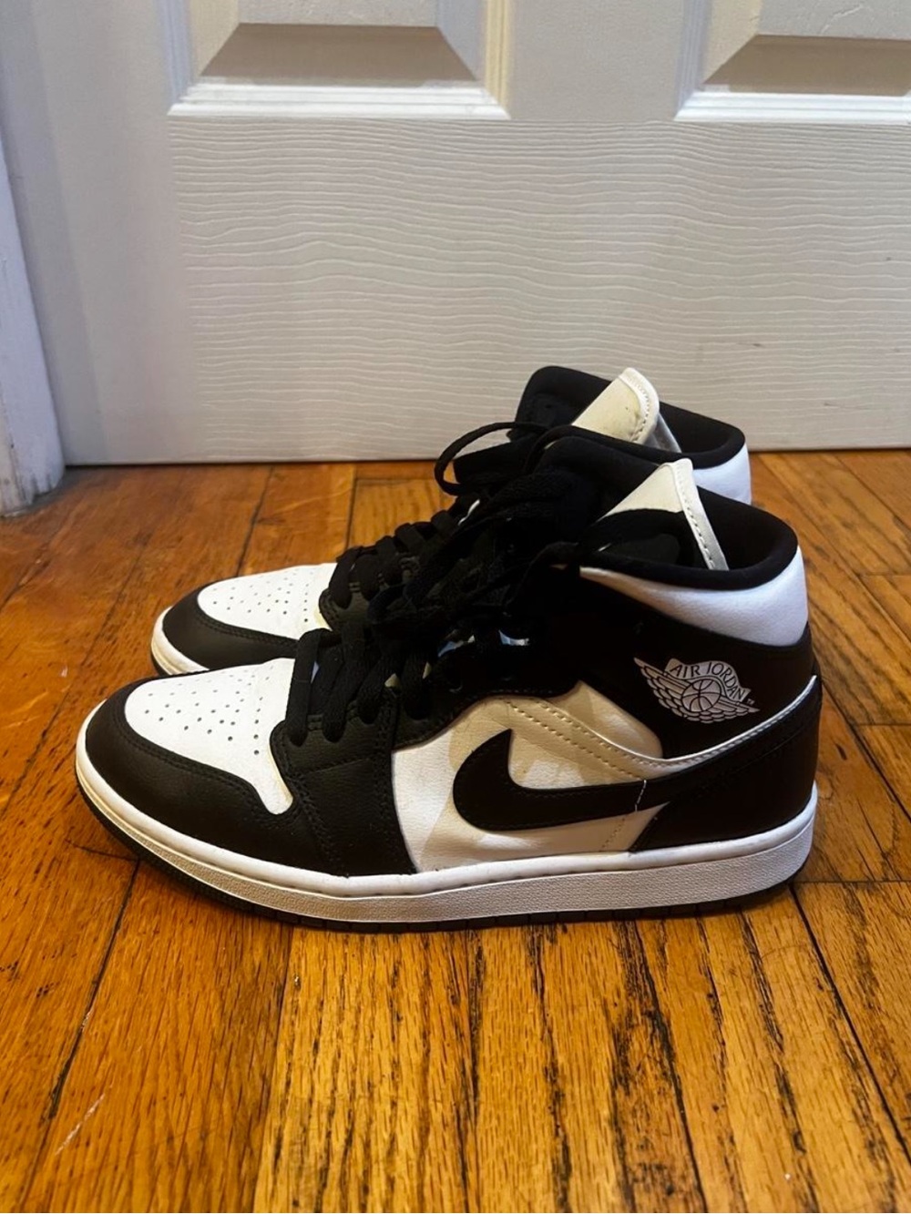 Nike Air Jordan 1 Black and White Mid-Top Sneakers